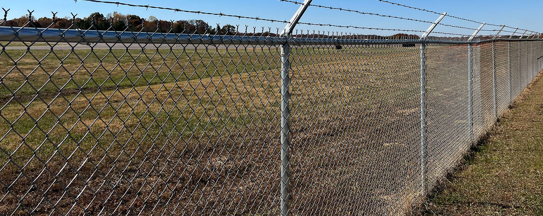 Galvanized round fence tubing used in a chain link fence