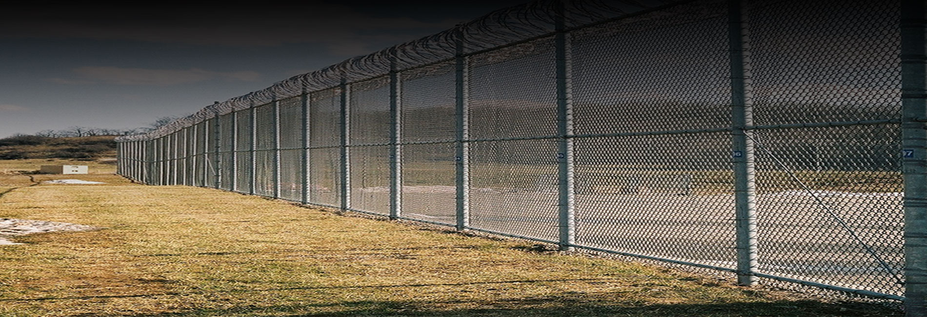 PT40 in use with barbwire fence security topper