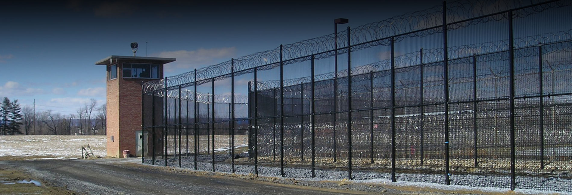 Black color coated security fence at a prison application